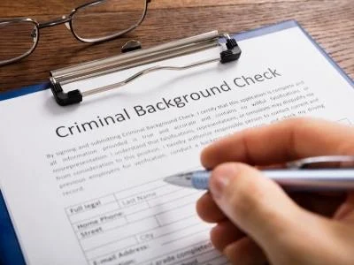 person filling out a background check