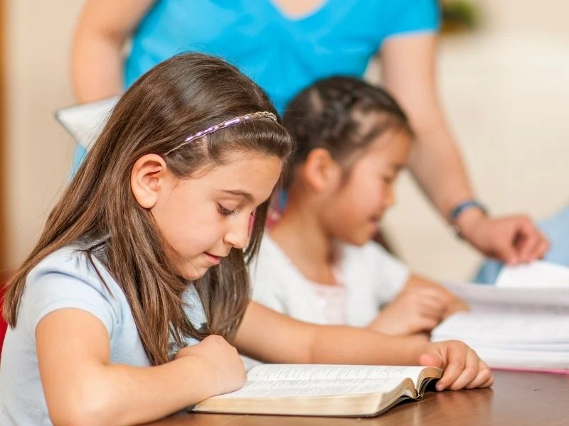 children reading the bible