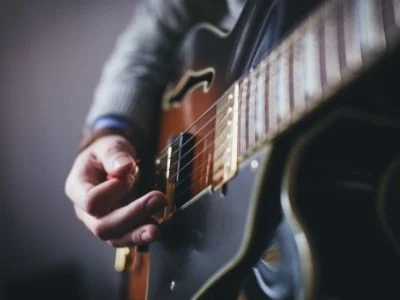 Musician playing a guitar