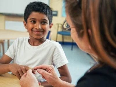 Helper Volunteer talking with a child